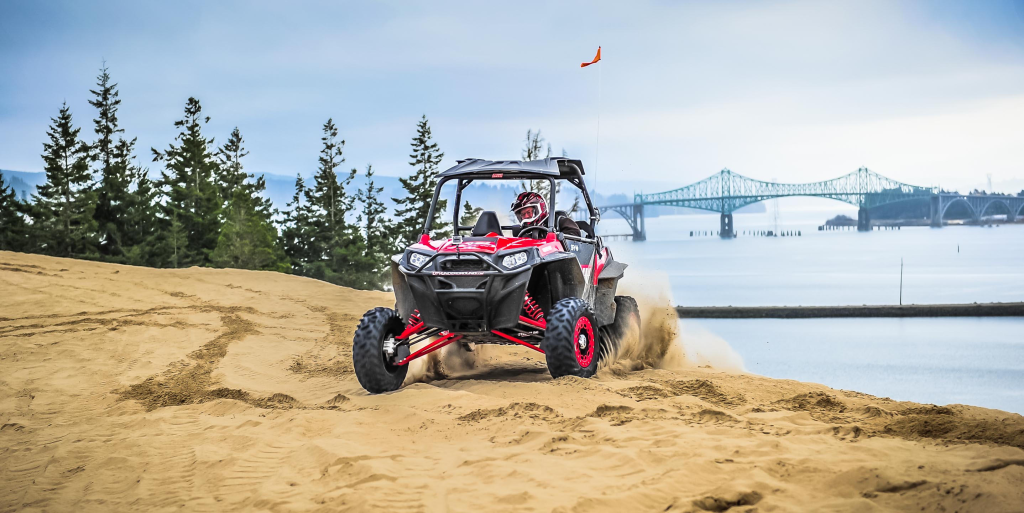A RZR riding in the dunes