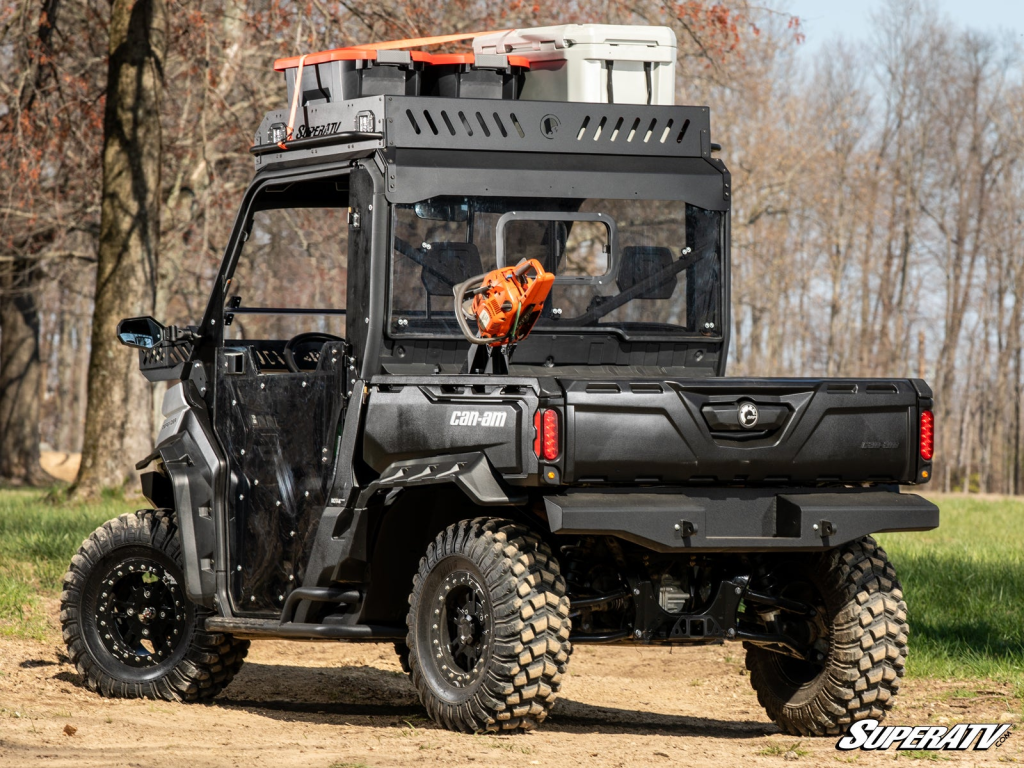 A Defender HD11 with an Outfitter roof rack and chainsaw mount