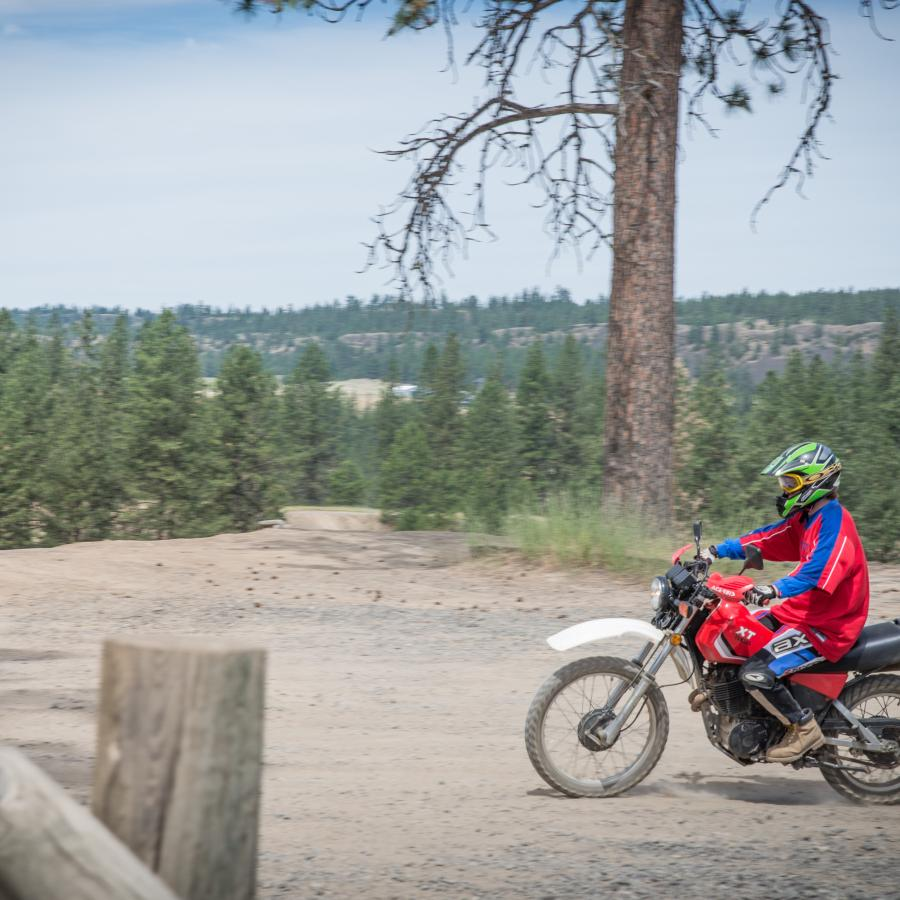 a dirt bike on a trail at riverside state park orv area