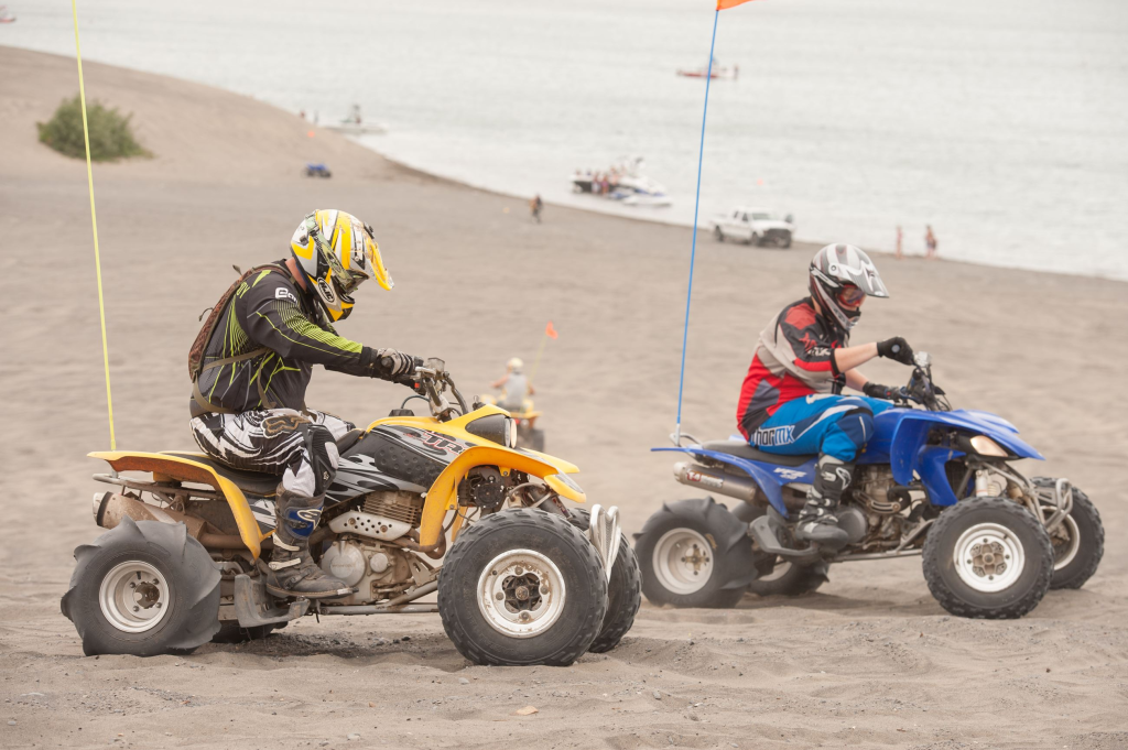 Two ATVs riding in Moses Lake Sand Dunes