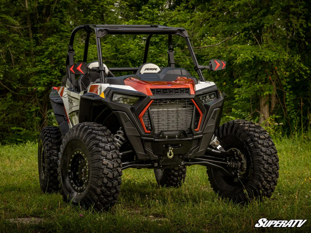 A RZR with offset A-arms and big tires