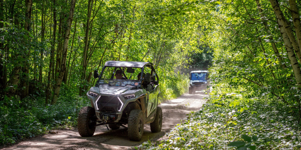 2 utvs on a hardpack trail in st. lawrence county