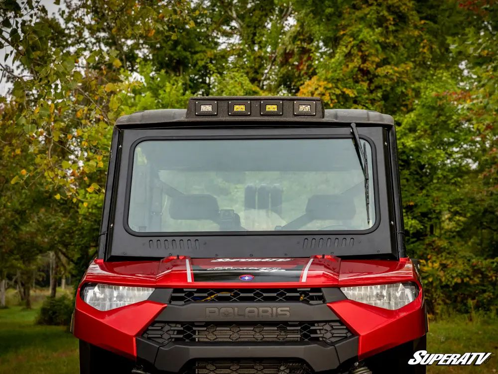 A Full glass windshield on a Polaris Ranger