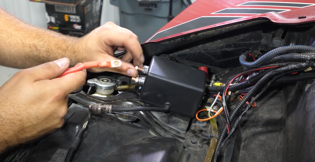 Braden connecting the red wire to the red terminal on the solenoid.