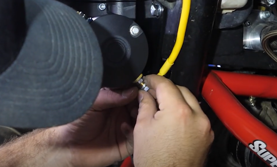 Braden connecting the yellow wire to the back of the winch.