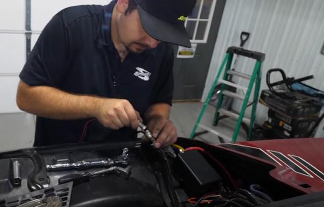 Braden fastening the two ends of the rocker switch wire together.