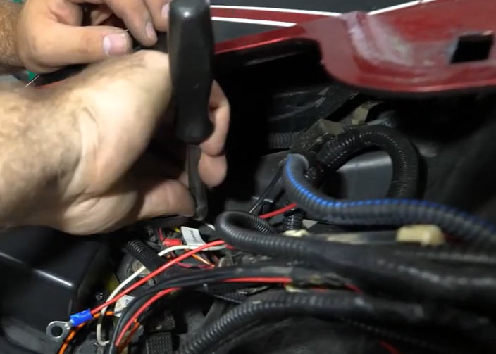 Braden tightening the screws holding down the solenoid.