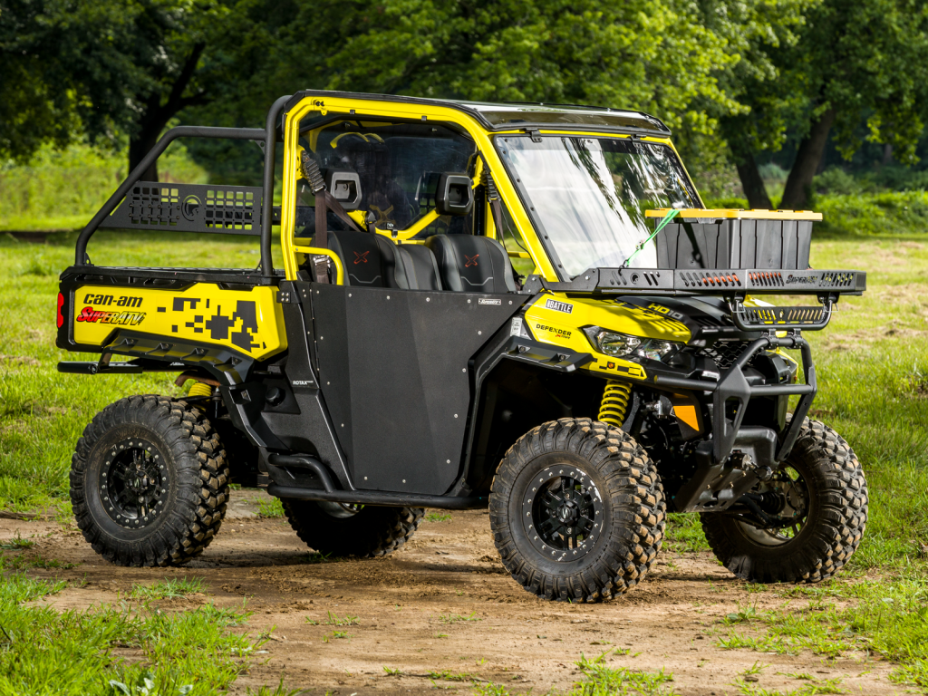 A bright yellow Can-Am Defender suped up with SuperATV's Hood Rack Charlie over the front end.