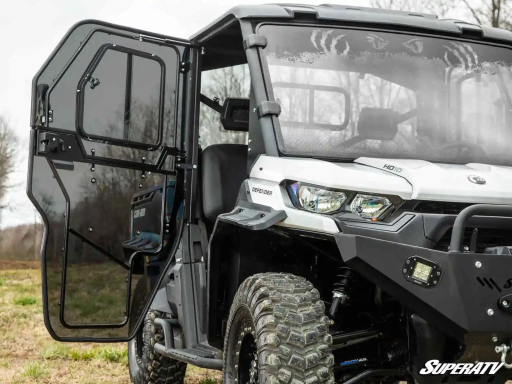 A Can-Am Defender HD10 with full cab doors and windshields.