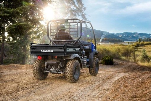A Kawasaki Mule driving off into the sunset.