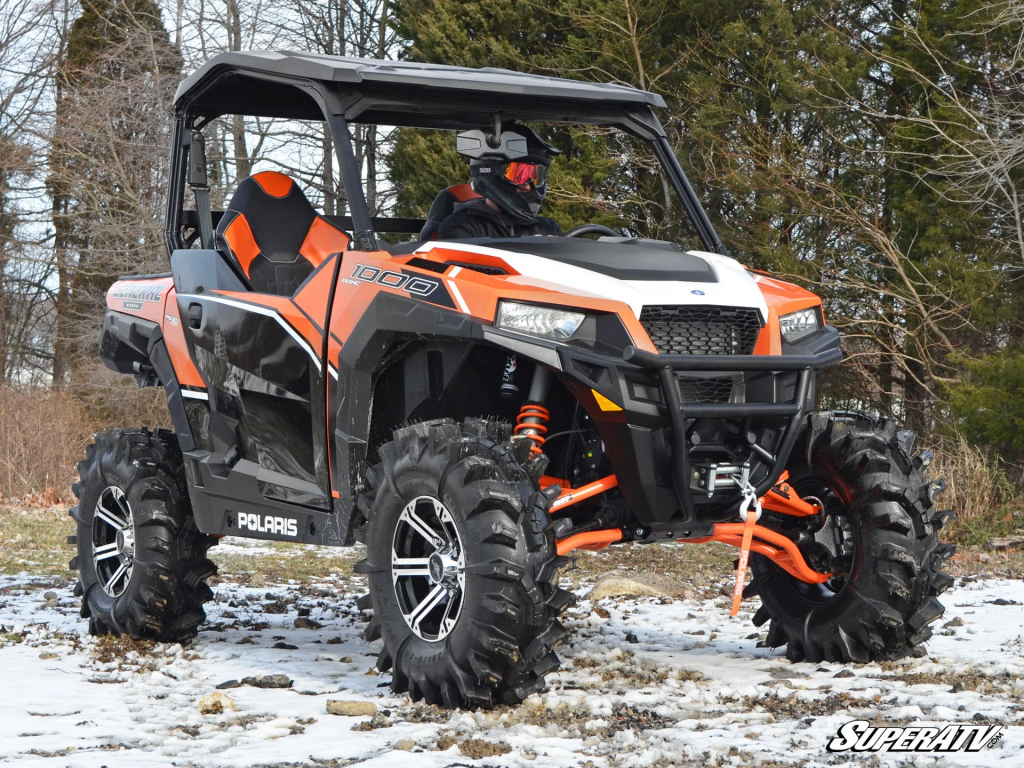 An orange and white Polaris General 1000.