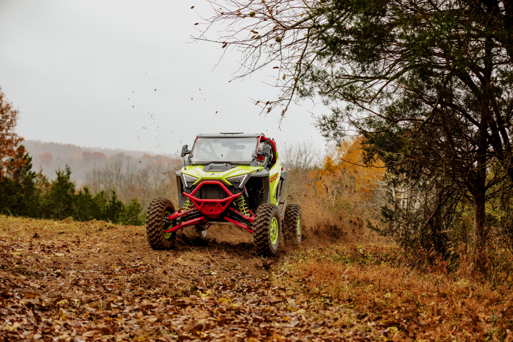 A Polaris RZR with a SuperATV windshield installed.