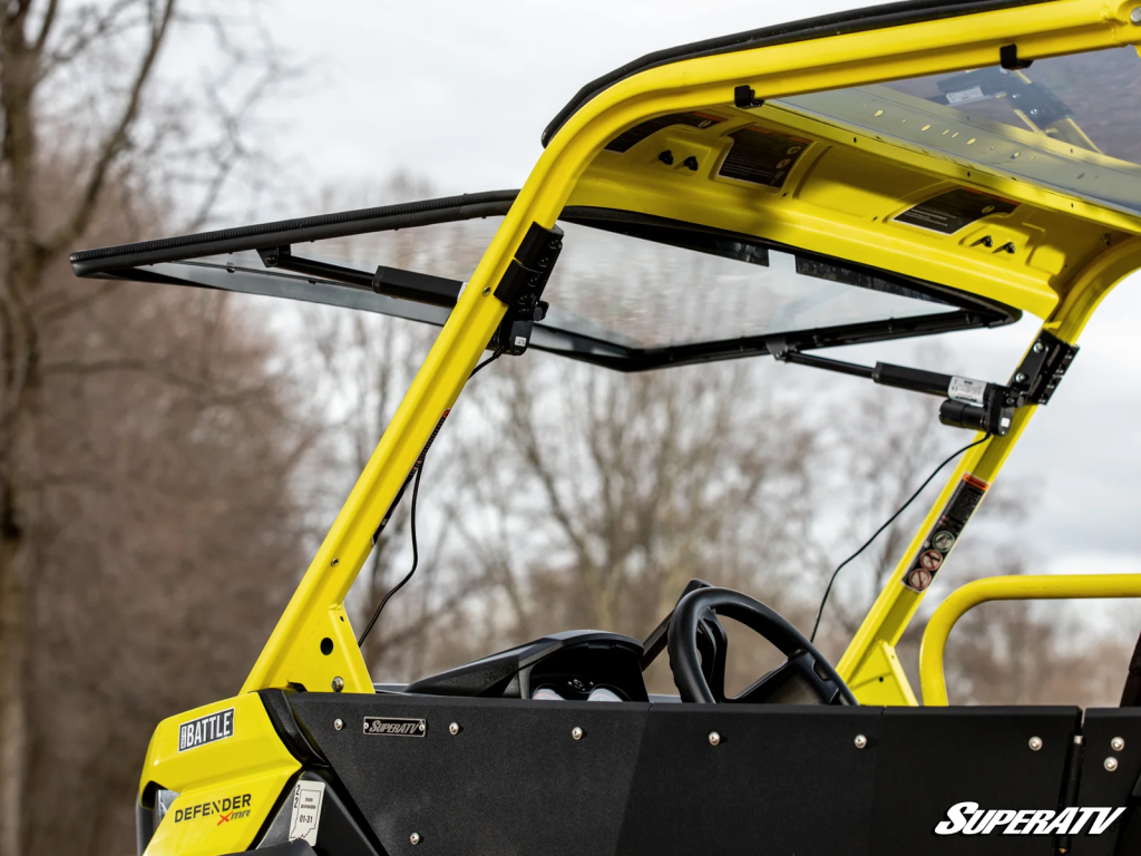 SuperATV MaxDrive Power Flip Windshield installed on a Can-Am Defender.