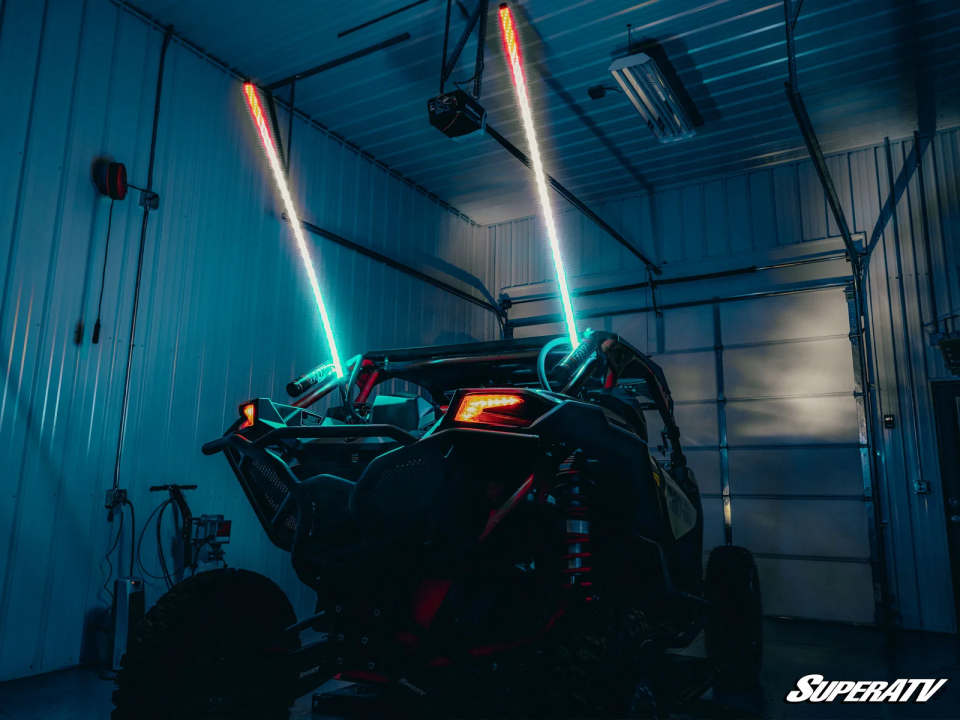 A UTV with SuperATV LED Whip Lights installed on the rear.