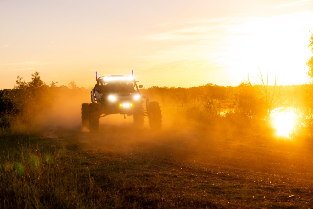 A UTV with SuperATV Magnum Whip Lights installed.