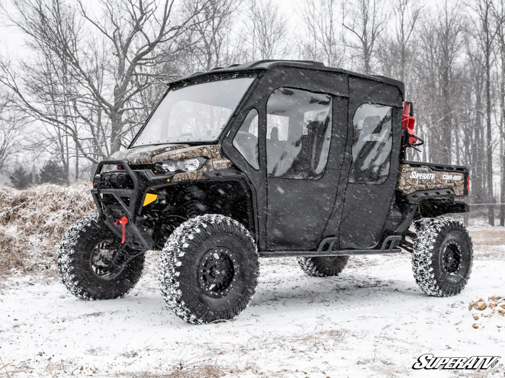 A Can-Am UTV with a SuperATV Soft Cab Enclosure installed.