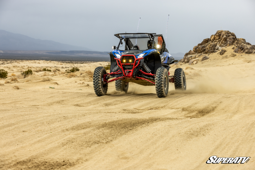A side-by-side racing over whoops in Johnson Valley