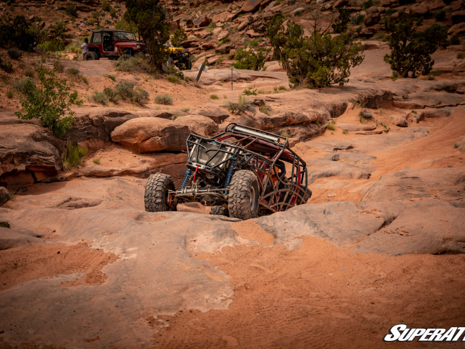 A UTV riding in the desert.