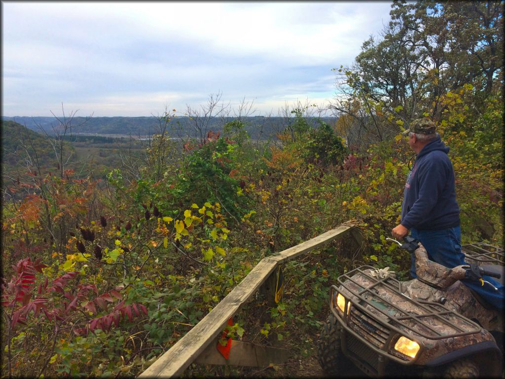 A rider looking over the view at Trout Valley OHV Trails.