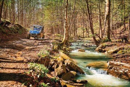 A UTV on a trail.