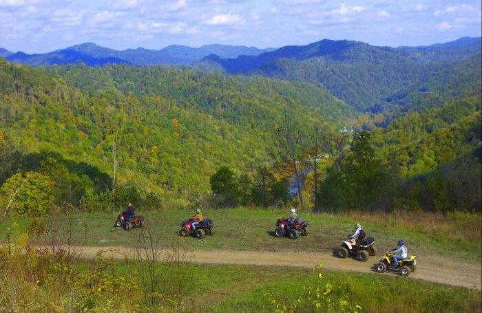 A group of ATVs enjoying a scenic overlook in West Virginia.