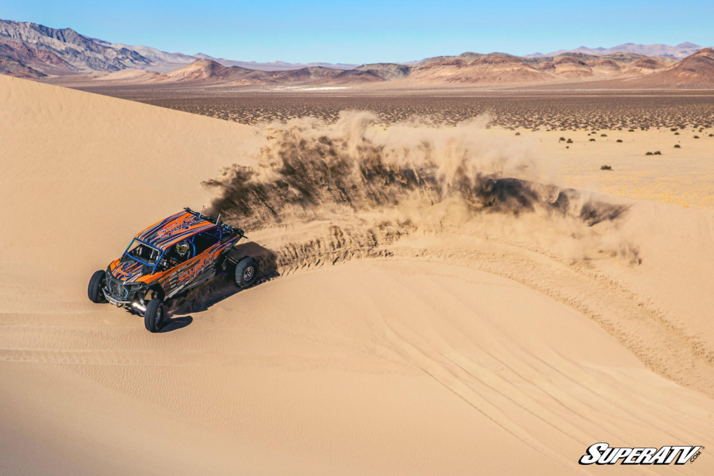 A UTV ripping through the dunes.