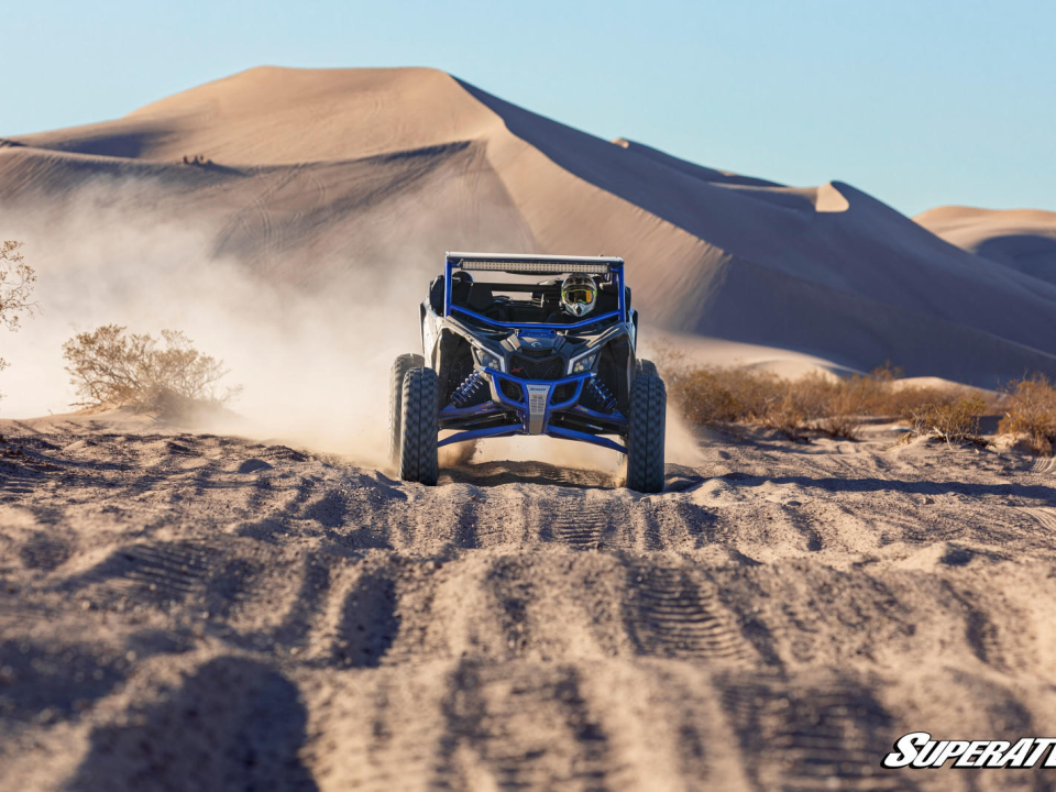 A UTV riding through the dunes.