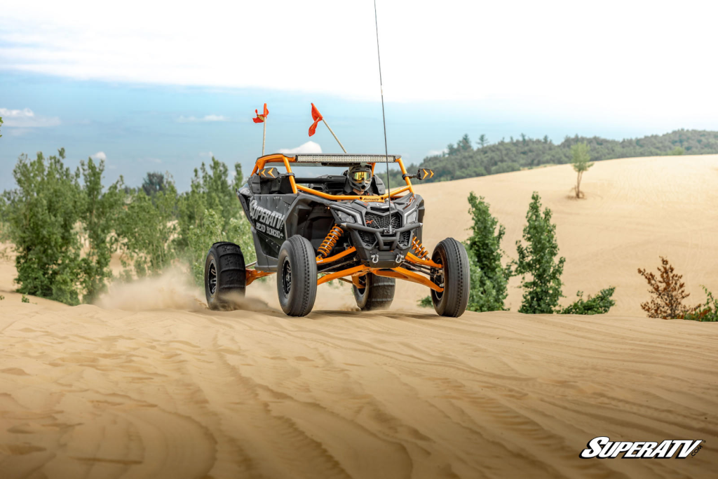 A UTV riding through the desert decked out in SuperATV parts.