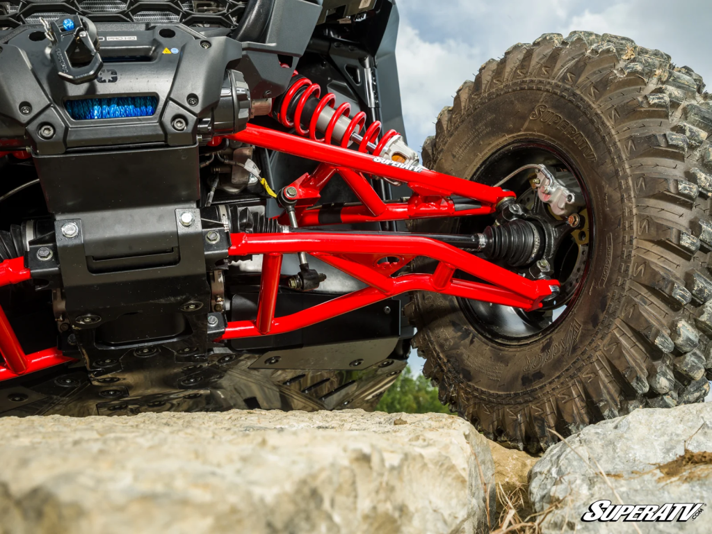 A RZR XP's suspension on rocks