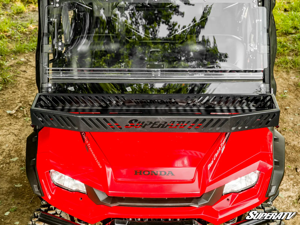 A honda pioneer with a superatv hood rack