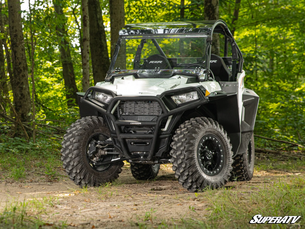 A Polaris RZR Trail in the woods