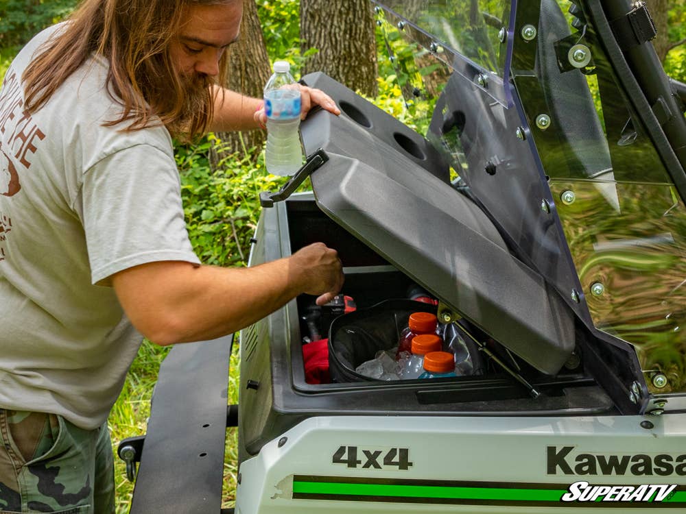 Erik using a bolt-on cargo box on the back of a Kawasaki Teryx.