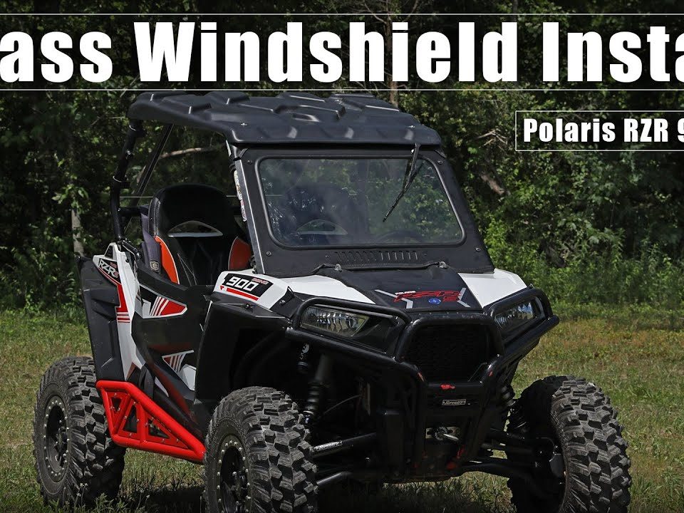 A Polaris RZR 900 with a SuperATV Glass Windshield installed