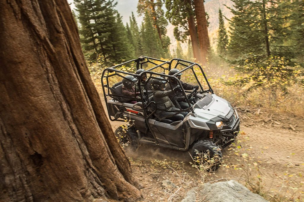 Honda Pioneer 700 riding through woods