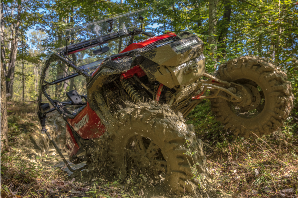 Honda Pioneer 1000-5 covered in mud