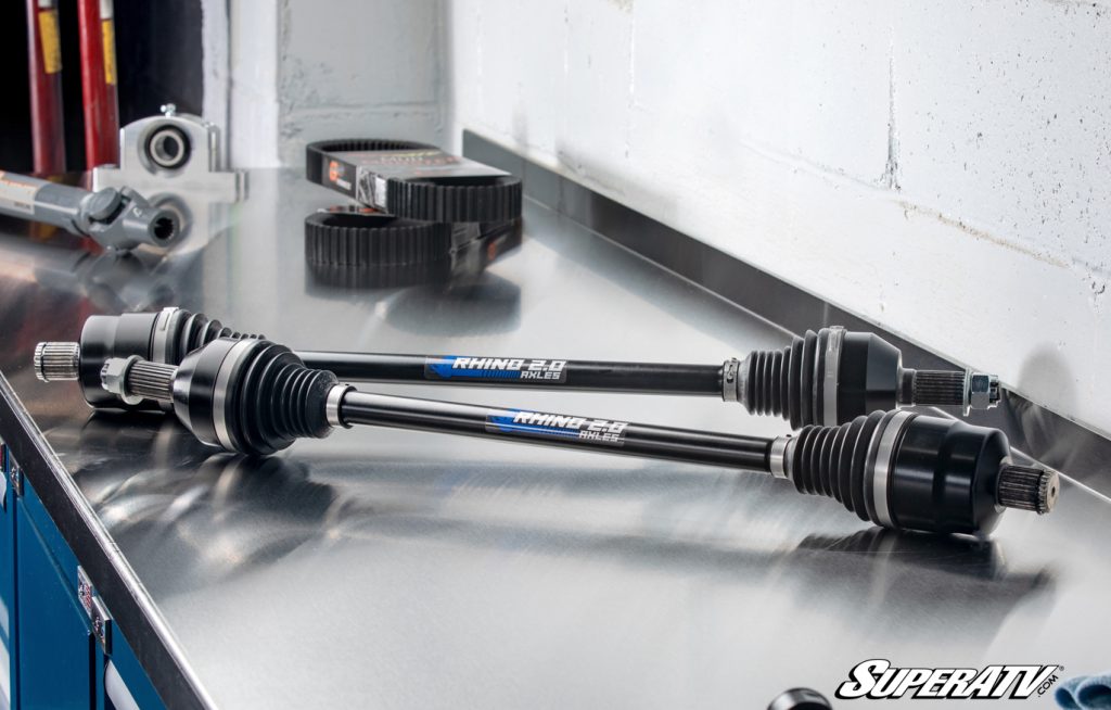 Rhino 2.0 Axles on a workbench. Axles aren't strictly a Polaris RZR XP 1000 accessory, but bigger axles like these are hard to pass up.