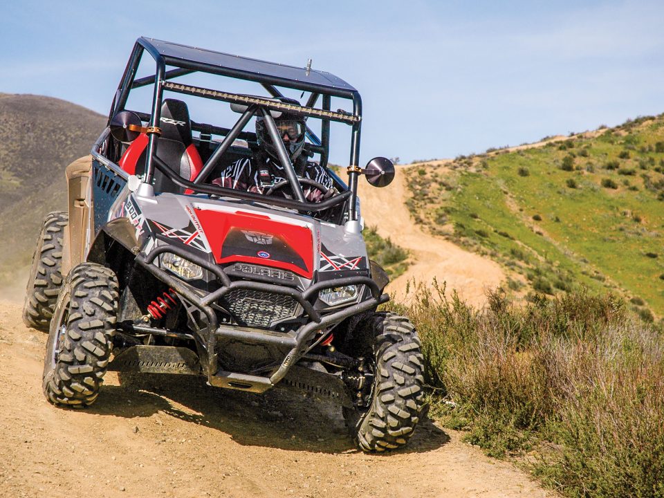 Polaris RZR coming down dirt path