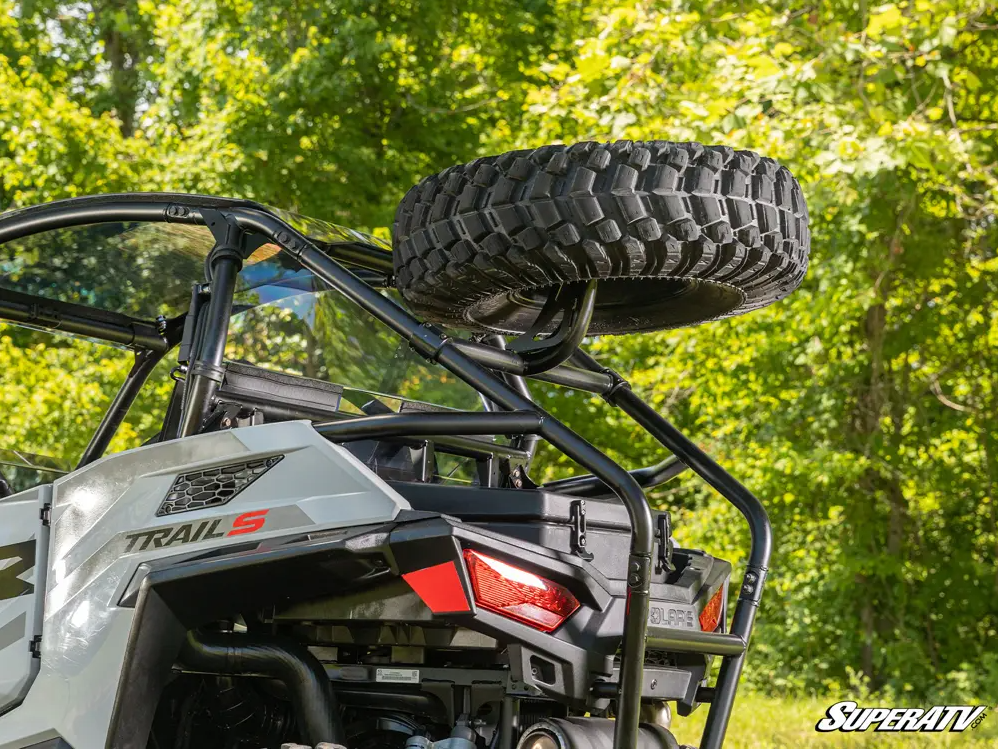 A spare tire carrier with a mounted XT warrior attached to it.
