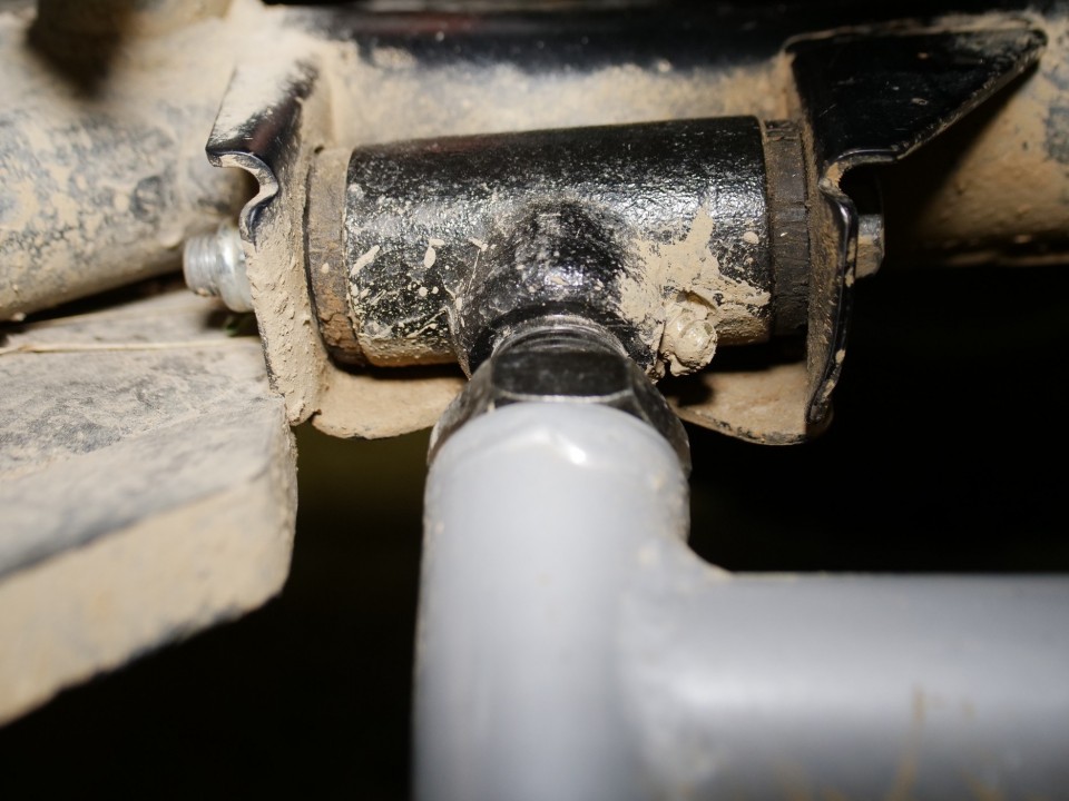 A SuperATV A-arm with adjustable pivot blocks and uhmw bushings