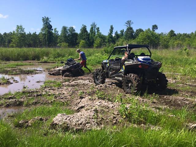 Polaris RZR XP 1000 pulling a 4 wheeler out of the mud