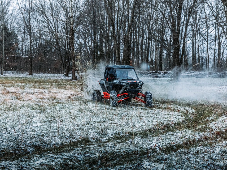 Polaris RZR XP 1000 riding in snow